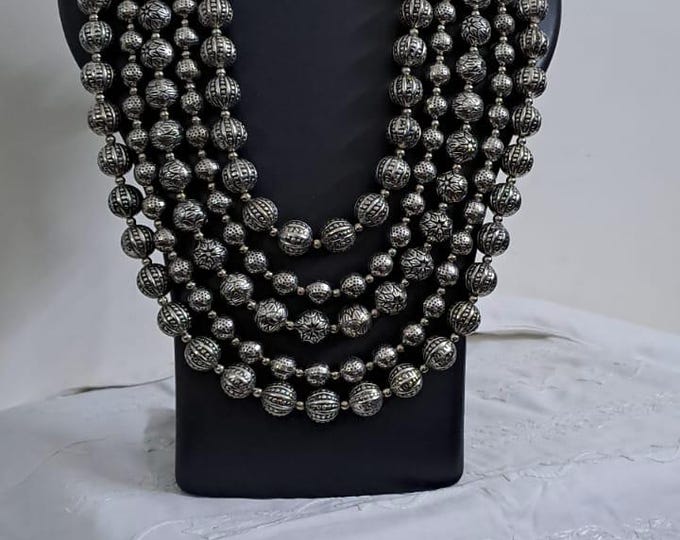 Multi-layered silver oxidised beads necklace .