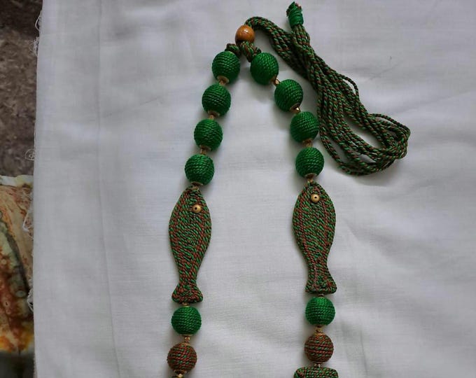 Exclusive brown n green thread necklace with fish shape thread beads and matching earrings.