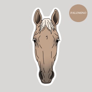 May include: A sticker featuring a Palomino horse head illustration. The horse has a tan coat, a white mane, and dark eyes. The word "PALOMINO" is in a brown circle in the upper right corner. The sticker has a white border and a gray background.