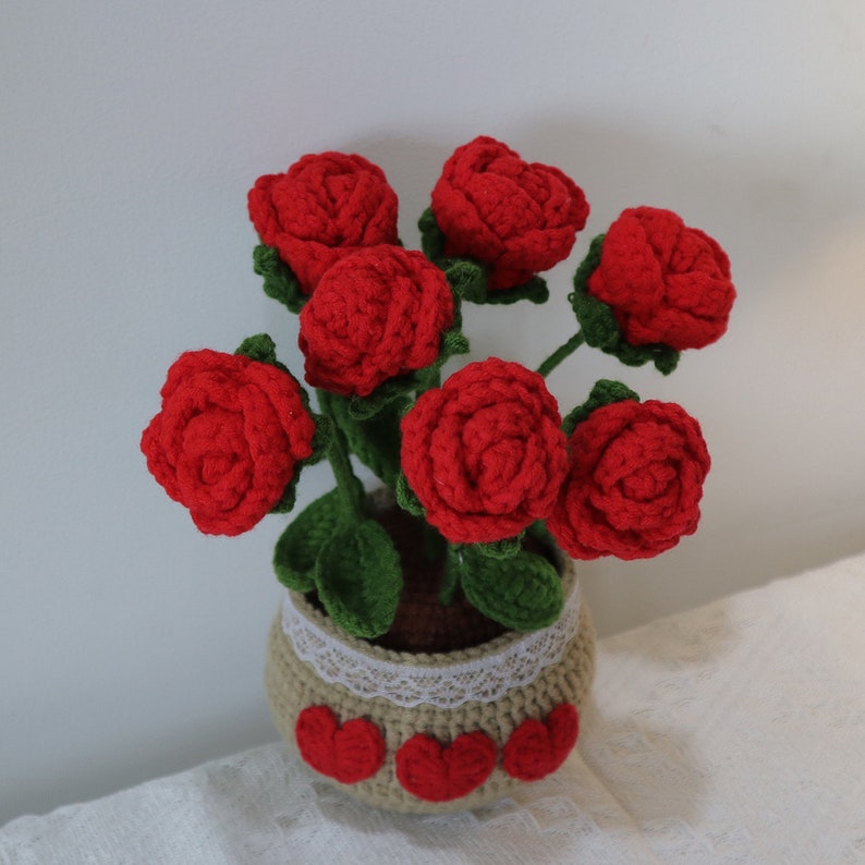 Knitted rose potted plants, each with 7 knitted roses on top, the roses are removable and can be pulled off the potted plants