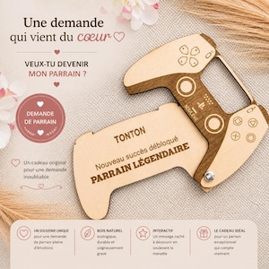 Könnte beinhalten: Geschenkanhänger in Form eines Holz-Gamecontrollers mit graviertem Text. Der Anhänger lautet "TONTON Nouveau succès débloqué PARRAIN LÉGENDAIRE". Der Controller hat Knöpfe und einen Griff.