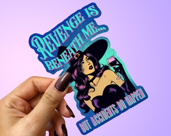 May include: A blue and purple sticker featuring a witch holding a glass of wine. The text on the sticker reads "Revenge is beneath me... but accidents do happen."