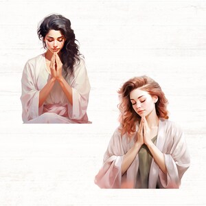 May include: Two women in white robes with their hands clasped in prayer. The woman on the left has dark hair and the woman on the right has light brown hair.