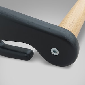 May include: Close-up of a black wooden clothes hanger with a natural wood dowel. The hanger features a curved design with a hook and a metal screw for assembly. The wooden dowel is light brown.