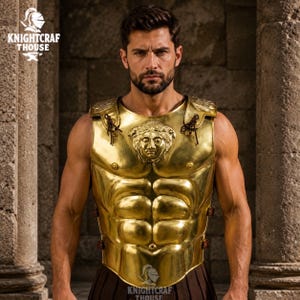 May include: A gold-coloured breastplate with a Medusa head emblem, part of a historical costume. The armour has a polished finish and is worn by a person. The Knightcrafthouse logo is visible in the image.