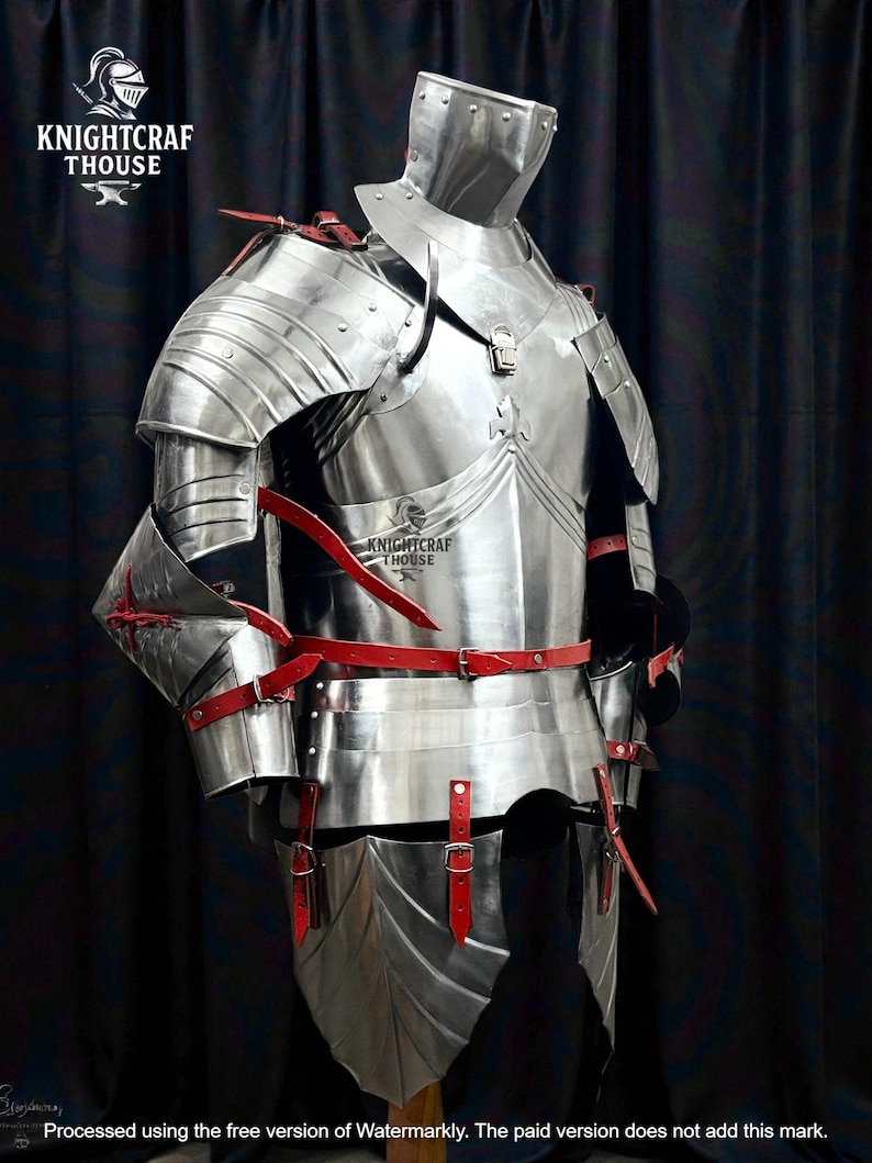 May include: A full suit of polished steel armor with red leather straps and accents. The armor includes a helmet, chest plate, shoulder guards, arm and leg protection. The image includes the text "KNIGHTCRAF THOUSE".