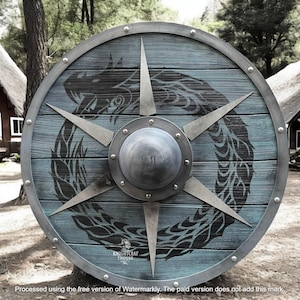 May include: A round, wooden shield with a teal and gray color scheme. The shield features a central metal boss and radiating metal spikes. A black dragon design encircles the center. The text "KNIGHTCRAF THOUSE" is visible at the bottom.