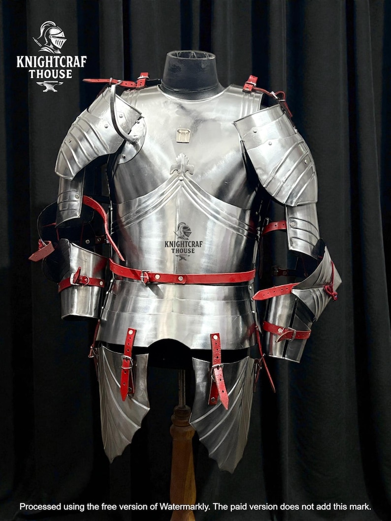 May include: A full suit of polished steel armor with red leather straps and accents. The armor includes a breastplate, shoulder guards, arm and leg protection. The text "KNIGHTCRAF THOUSE" is visible on the armor.