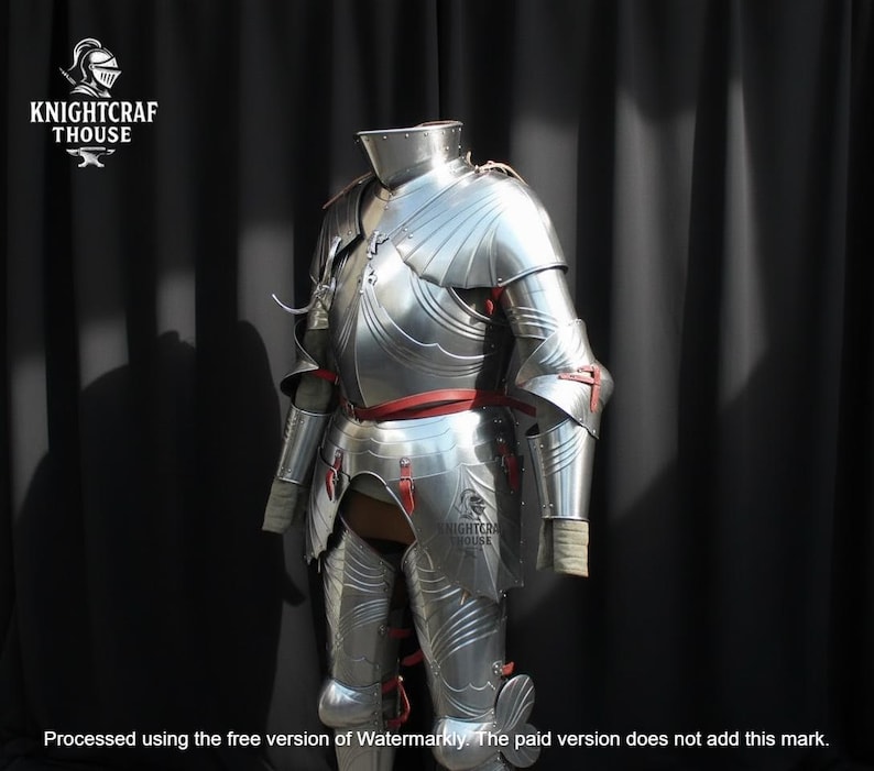 May include: A full suit of polished steel armor, featuring articulated plates and red leather accents. The armor is displayed against a dark backdrop, showcasing the intricate craftsmanship and historical design. The Knightcrafthouse logo is visible.