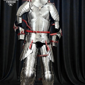 May include: A full suit of polished steel armor with red leather straps and accents. The armor includes a helmet, chest plate, arm and leg protection. The image includes the text "KNIGHTCRAF THOUSE".