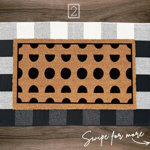 a door mat with a black and white pattern on it