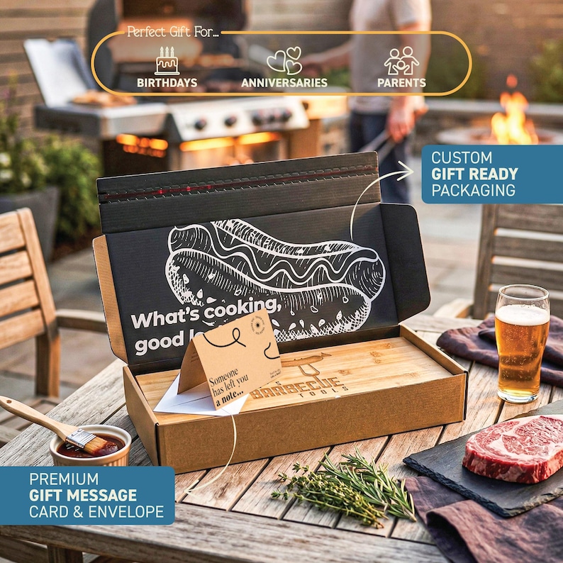 a gift box with a hot dog drawing on it, placed on a wooden table with a glass of beer and some herbs. The box is labeled as a "Perfect Gift For..." and includes a "Premium Gift Message Card & Envelope".