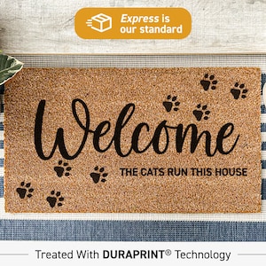 a welcome mat with the words welcome to the cat's run this house
