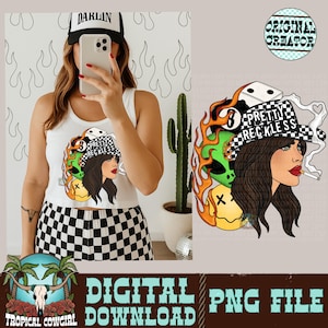 May include: White tank top and black and white checkered shorts. The tank top features a graphic of a woman with a cigarette, flames, and the text "PRETTY RECKLESS". A black and white hat with the word "DARLIN" is worn.