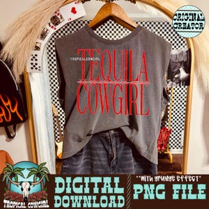 May include: A gray sleeveless t-shirt with the words "TEQUILA COWGIRL" in red, with the text "TROPICALCOWGIRL" above the words. The shirt is paired with denim shorts. The image also includes the text "DIGITAL DOWNLOAD PNG FILE".