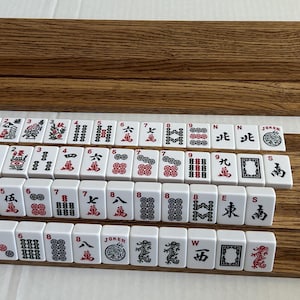 A set of two (2) double Mahjong racks made for two players.