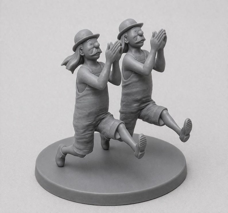 May include: A grayscale sculpture of two figures in matching outfits, each wearing a bowler hat and shorts. They are in a running pose with their hands clasped together. The sculpture is mounted on a circular base.