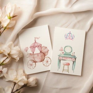May include: Two watercolor illustrations on white cardstock. The first illustration shows a pink carriage with a white canopy and pink hearts. The second illustration shows a vanity with a mirror, a stool, and a crown.