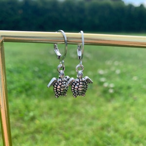 Silver turtle hoop earrings