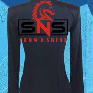 May include: Black long-sleeve shirt with a red horse head logo and the text "SNS SHOWNSHINE" in a white rectangle.