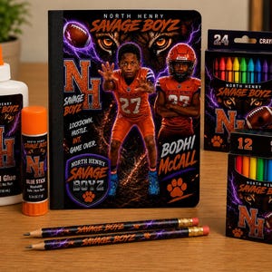 May include: A North Henry Savage Boyz school supply set featuring a notebook, school glue, glue stick, 24 crayons, 12 colored pencils, and two pencils. The items display football imagery, orange and black colors, and the text North Henry Savage Boyz.