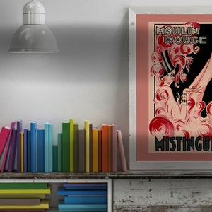 May include: A vintage poster advertising the Moulin Rouge with a red and black illustration of a woman in a hat and a long, flowing dress. The text "Moulin Rouge" and "Mistinguett" are visible in the poster.