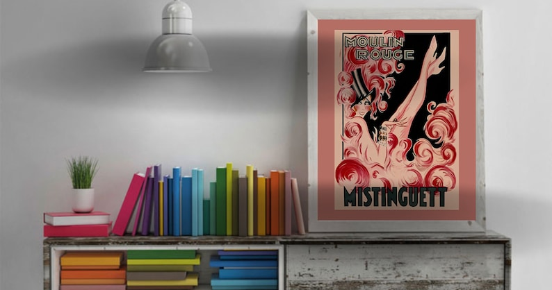 May include: A vintage poster advertising the Moulin Rouge with a red and black illustration of a woman in a hat and a long, flowing dress. The text "Moulin Rouge" and "Mistinguett" are visible in the poster.