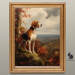 Puede incluir: Una pintura enmarcada de un perro de caza marrón y blanco de pie en una cornisa rocosa en un entorno boscoso. El perro mira hacia la derecha, con una vista lejana de un valle y colinas en el fondo. La pintura está colocada contra una pared gris claro.