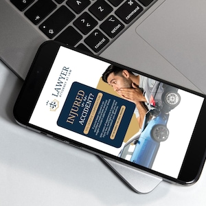 May include: A smartphone displaying a website for a lawyer. The website features a blue and gold color scheme and text that reads "Injured in an Accident? You deserve compensation." The image also shows a man in a car accident.
