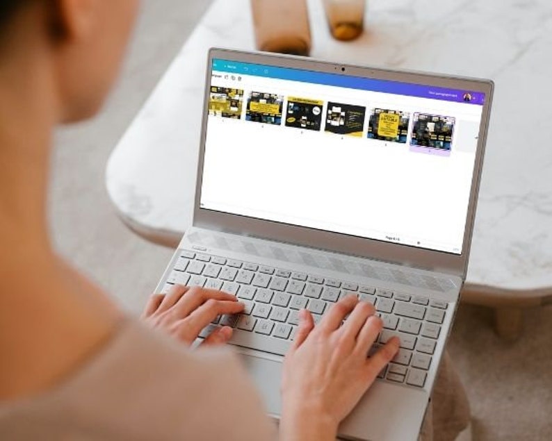 May include: A person is using a laptop computer with a white keyboard. The laptop screen displays a web page with several colorful squares. The squares contain images and text.
