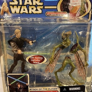 Star wars attack of the clones: anakin skywalker with lightsaber slashing action