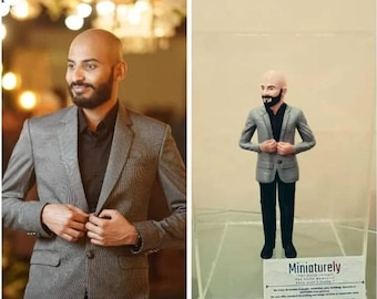 May include: A photograph shows a man in a grey blazer next to a 3D-printed miniature of him in a display case. The miniature is wearing a similar outfit. The text "Miniaturely" is displayed on the case.