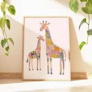 May include: A framed art print featuring two giraffes with patchwork patterns in various colors. The giraffes stand on a light pink background. The frame is made of light-colored wood. The artwork is a whimsical depiction of the animals.