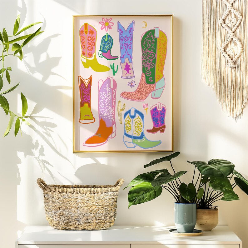 May include: A colorful illustration of cowboy boots with floral and geometric patterns on a pink background. The boots are in various colors, including pink, yellow, green, blue, and orange.