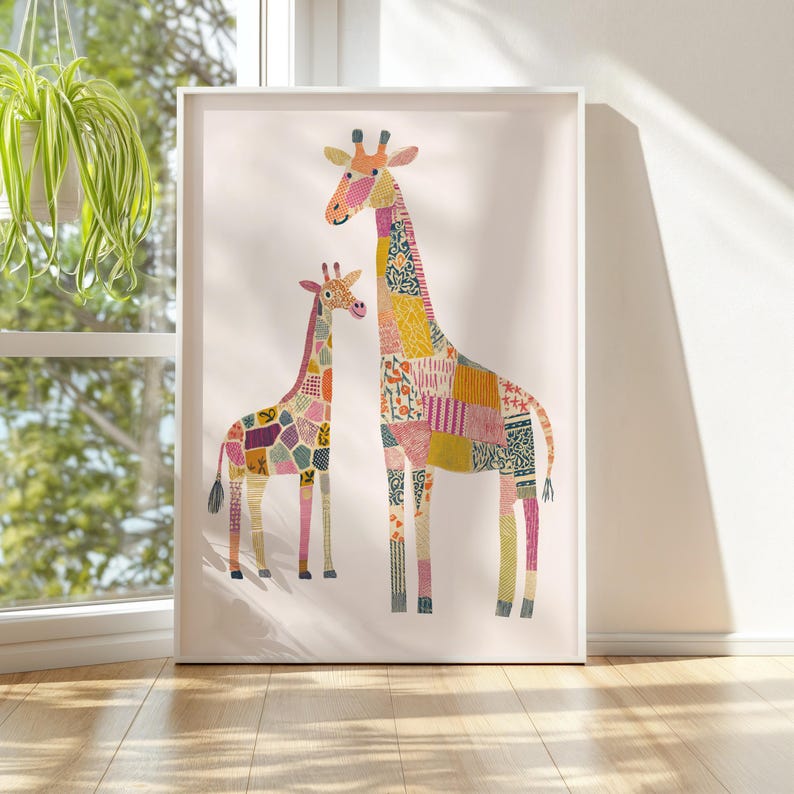 May include: A framed art print featuring two giraffes with patchwork-style patterns. The larger giraffe is taller than the smaller one. The giraffes have a variety of colors, including pink, yellow, and purple. The artwork is displayed on a white background.
