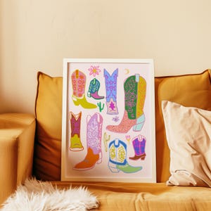 May include: A colorful print featuring a variety of cowboy boots with floral and geometric patterns on a pink background.