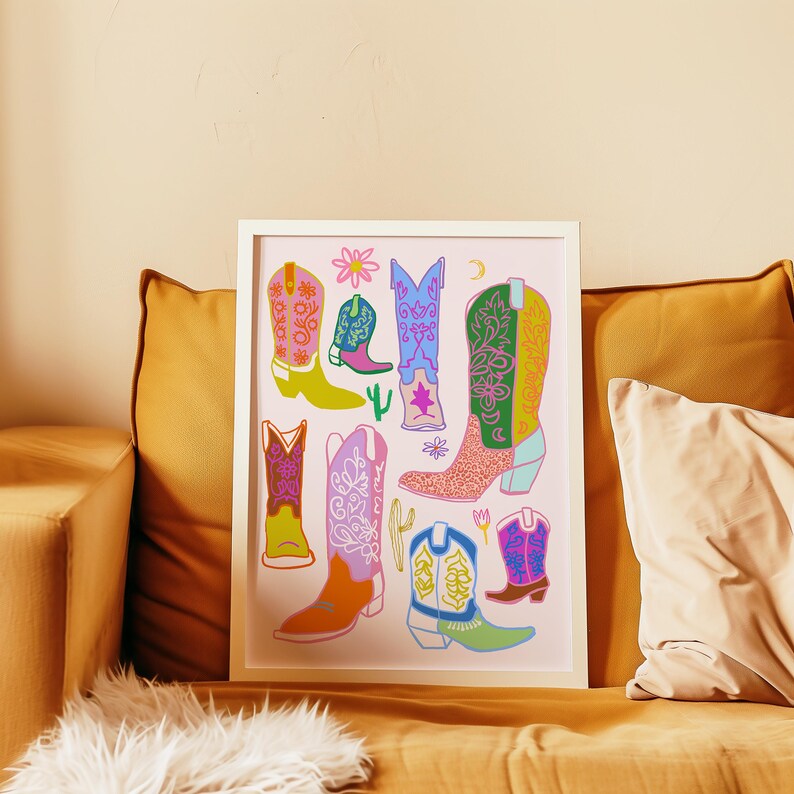 May include: A colorful print featuring a variety of cowboy boots with floral and geometric patterns on a pink background.