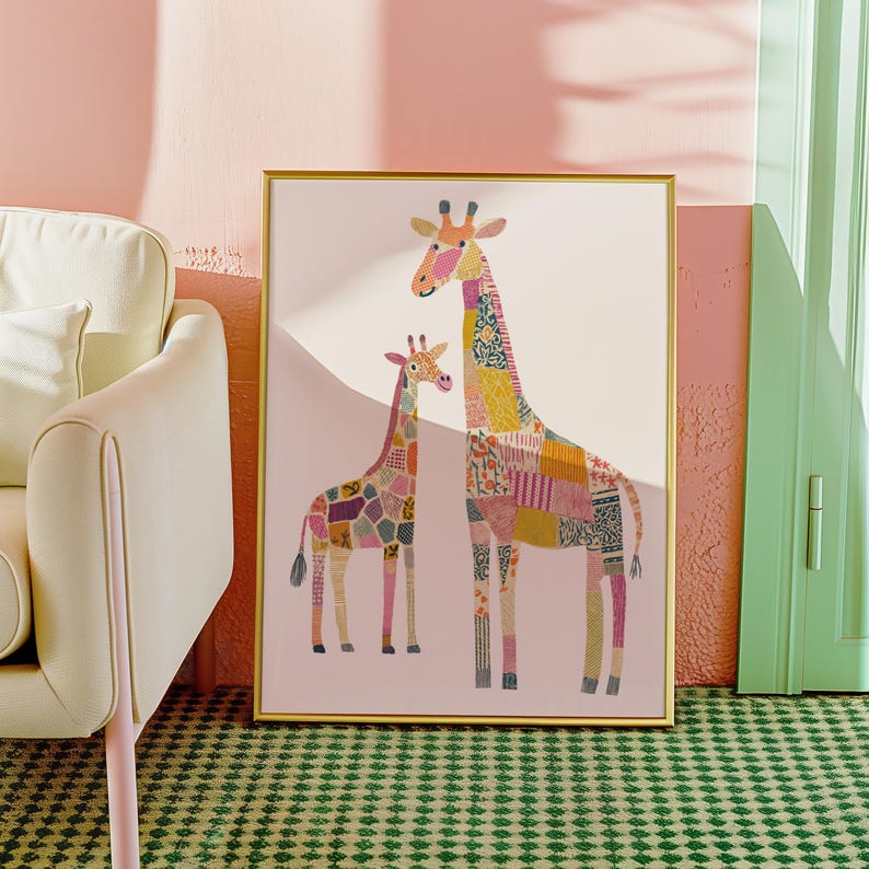 May include: A framed art print featuring two giraffes with patchwork patterns in various colors. The larger giraffe has a yellow, orange, and pink design, while the smaller one has a purple, pink, and brown design. The background is a soft pink.