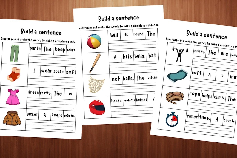 May include: Three educational worksheets titled Build a sentence, featuring rows of colourful illustrations including trousers, socks, a dress, a jacket, a ball, a bat, a net, a helmet, a weightlifter, a mat, a rope, and a timer with scrambled words to rearrange.