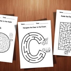May include: Three white activity sheets with black line drawings of mazes. One maze is shaped like an apple, another like a letter C, and the third is a square. Each sheet has a title, "Guide the Hamster to the Apple", "Navigate the Deer to the Forest", and "Guide the Farmer to the Barn".