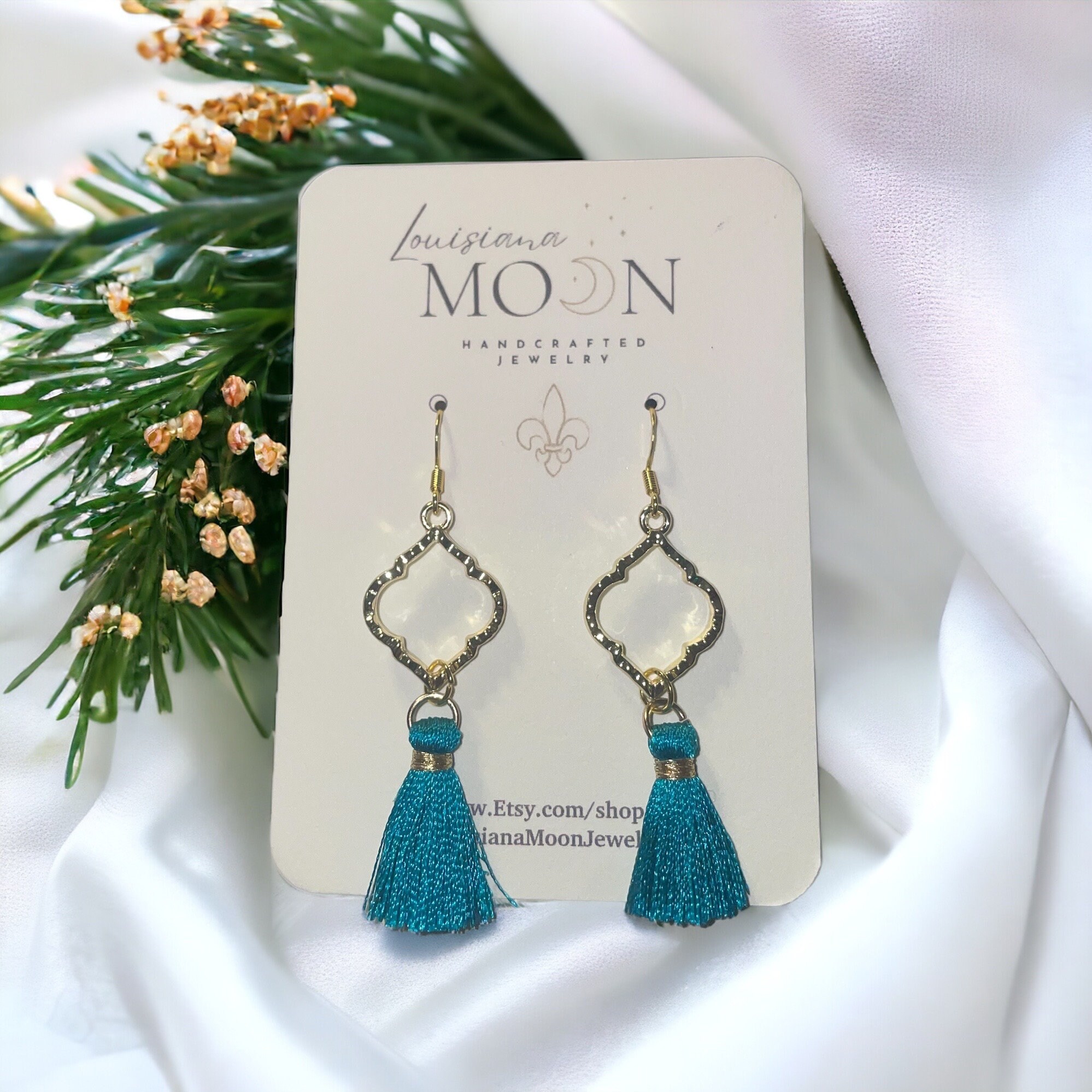 Gold earrings with teal tassels