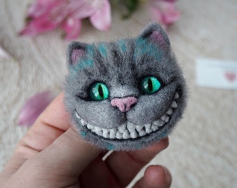 Naaldvilte Cheshire Cat broche: uniek accessoire voor fans van Alice in Wonderland