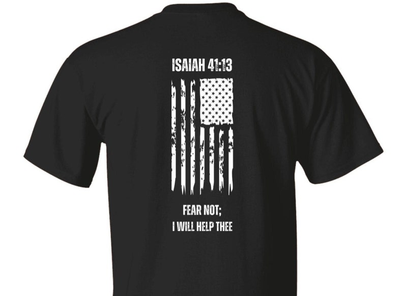 May include: Black t-shirt with a distressed white American flag and the text "ISAIAH 41:13 FEAR NOT; I WILL HELP THEE" printed on the back.