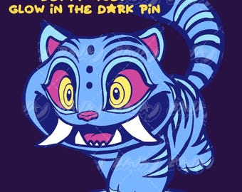 May include: A blue cartoon tiger pin with yellow eyes, pink accents, and white fangs. The pin has the text "K-POP DEMON HUNTERS DERPY TIGER GLOW IN THE DARK PIN" and "PRE-ORDER" in yellow. The tiger is set against a dark purple background.