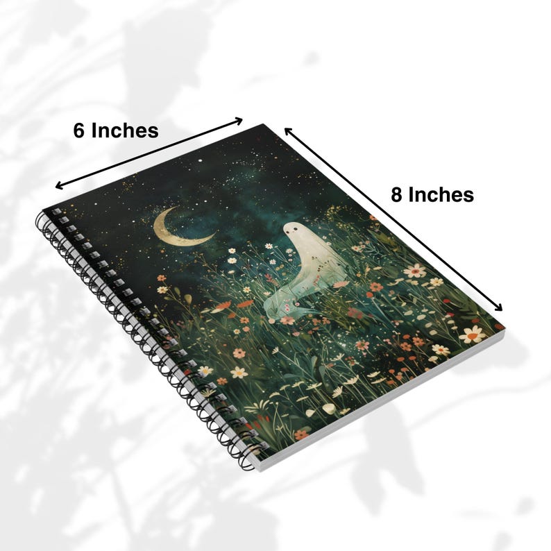 May include: Spiral-bound notebook featuring a whimsical illustration of a ghost in a field of flowers under a crescent moon and starry night sky. The notebook measures 6 x 8 inches.