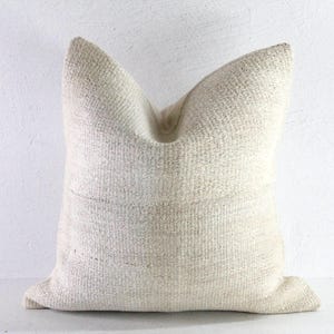 May include: A rustic wooden sign with the text "Welcome to our home" in white lettering. The sign features a distressed finish and a simple, inviting design, perfect for front door decor.