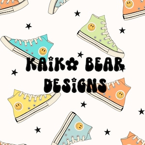 May include: A seamless pattern featuring colorful high-top sneakers with smiley faces on the sides. The sneakers are arranged in a repeating pattern on a white background with black stars. The text "KAIK * BEAR DESIGNS" is centered in the middle of the image.