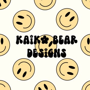 May include: A white background with a repeating pattern of yellow smiley faces. The text "KAIK* BEAR DESIGNS" is in the center of the image in black.