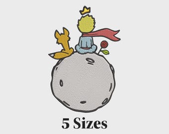 May include: Embroidered design featuring the Little Prince with a fox, rose, and planet. The Little Prince is wearing a crown and red scarf. The text "5 Sizes" is at the bottom. The design is in shades of yellow, blue, red, and gray.