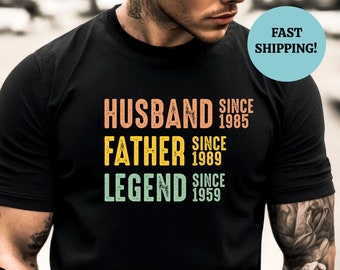 May include: Black t-shirt with the text "Husband since 1985, Father since 1989, Legend since 1959" in a vintage style.